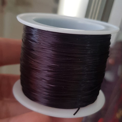 Cuộn Dây Thun CO GIÃN màu Đen xỏ vòng hạt chuỗi Dây này là dây thun chuyên xỏ vòng chuỗi màu Đen, có đủ màu Anh Chị đang đeo chuỗi muốn thay dây khác cho vòng thì đặt cuộn Thun chỉ này nhé