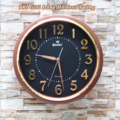 Đồng Hồ NHẠC CHUÔNG Báo Giờ Có 16 Điệu NHẠC GÕ Báo Giờ - Máy Kim Trôi EASTAR Nhật - Số nổi 3D Viền Nâu Mặt Đen – Tặng Pin Maxell - Bảo Hành 1 Năm