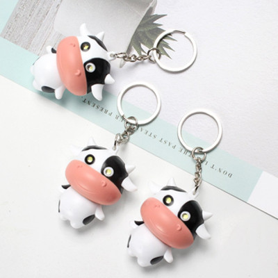 Móc khóa con bò sữa cute mắt có đèn phát sáng, phát ra tiếng kêu ngộ nghĩnh
