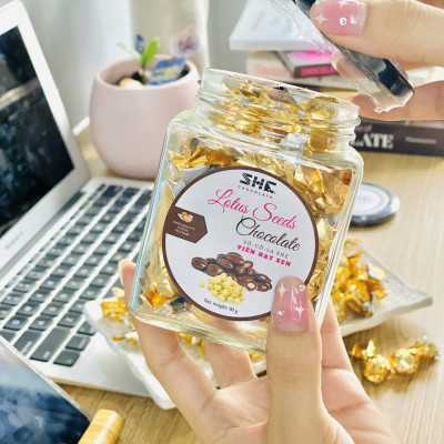 Socola viên Hạt sen - Hũ thủy tinh 90G - SHE Chocolate - Bổ sung năng lượng, đa dạng vị giác. Quà tặng sức khỏe, quà tặng người thân, dịp lễ, thích hợp ăn vặt
