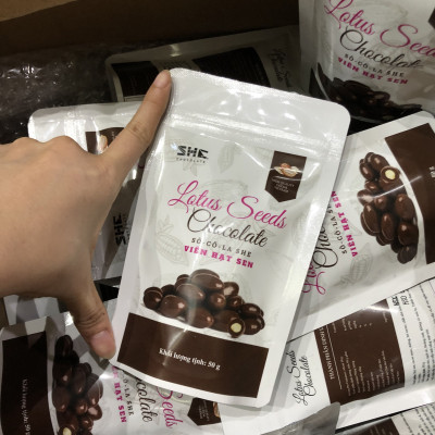 Socola viên Hạt sen - túi 50g -SHE Chocolate - Bổ sung năng lượng, đa dạng vị giác. Quà tặng sức khỏe, quà tặng người thân, dịp lễ, thích hợp ăn vặt