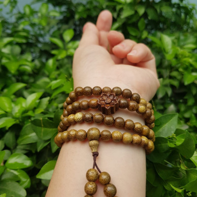 Vòng đeo tay nữ gỗ trầm mix bông hoa sen kiểu quấn tay 4 vòng may mắn tài lộc  Size hạt 6mm  Màu vàng nâu vân sáng nhẹ đeo tay rất đẹp xinh mùi thơm nhẹ nhẹ ạ